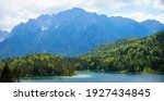 alpine landscape at springtime, lake Lautersee and green forest, bavarian wetterstein mountains near Mittenwald