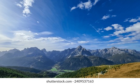 Alpine meadow on mount Helm (Monte Elmo) with scenic view of majestic mountains of untamed Sexten Dolomites, South Tyrol, Italy, Europe. Hiking concept Italian Alps. Looking from lift station Helmjet