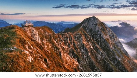 Alpine mountain panorama landscape at dramatic sunrise at Eisenerzer Reichenstein and hut in Styria, Austria Alps
