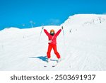 Alpine ski. Skiing woman skier going downhill on snow covered isolated white ski trail slope piste in winter. Good recreational female skier in white ski jacket and red outfit