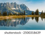 Alpine summer view with reflections and Mount Wilder Kaiser at Mount Astberg, Going, Kitzbuehel, Tyrol, Austria