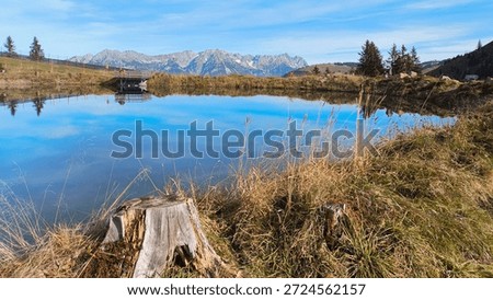 Alpine summer view with reflections and Mount Wilder Kaiser seen from Mount Kleine Salve, Itter, Kitzbuehel, Tyrol, Austria