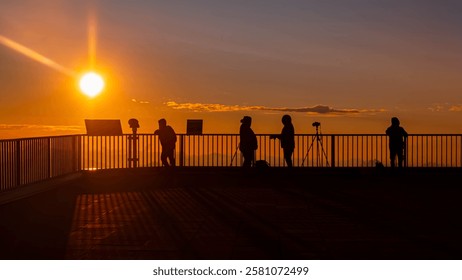 Alpine sunset or sundowner with phtographers at Mount Zugspitze, Top of Germany, Garmisch-Partenkirchen, Werdenfelser Land, Bavaria, Germany