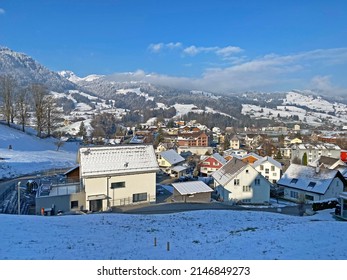 Alpine tourist, ski and agricultural village Nesslau on the slopes of a Alpstein mountain range and over the Obertoggenburg valley - Canton of St. Gallen, Switzerland (Schweiz) - Shutterstock ID 2146849273