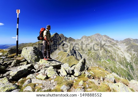 Similar – Hiker photographs the landscape