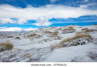 Alpine Tundra Winter Day On A Background Of Blue Sky