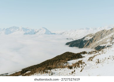 Alpine view with cloud inversion and snowy mountains, Sainte Foy Tarentaise, France