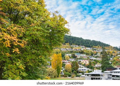 Alpine village colorful hillside residences mingled with luxuriant fall foliage, Queenstown New Zealand.