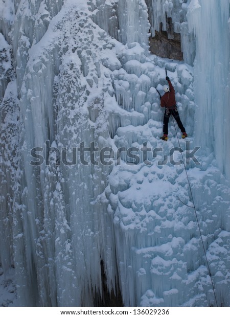Alpinist
ascenting a frozen waterfall in Ice park,
Ouray.