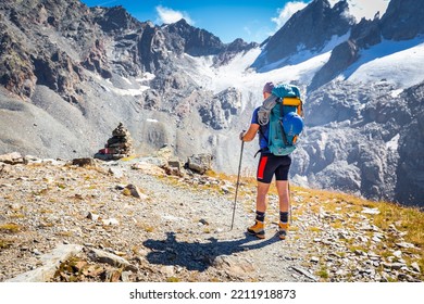 Alpinist Mountaineer Back View Standing Resting Looking At High Mountains Glacier  Peaks Ridge Range View, Italian Alps  Mountaineering Tourism, Travel Explore Europe Nature.