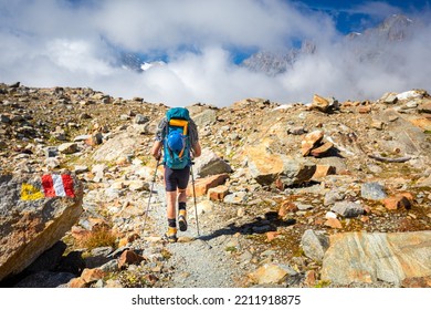 Alpinist Mountaineer Back View Walking Hiking  High Mountains Trail,  Peaks Ridge Range View, Italian Alps  Mountaineering Tourism, Travel Explore Europe Nature.