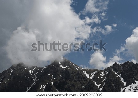alps in austria, cloudy mountain tops