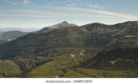 Alps mountain range in pine trees forest aerial view. Outdoor adventure. Alpine nobody nature landscape. Beautiful holiday at spring sunny day. Drone fly over mounts region in Dolomites, Italy, Europe - Powered by Shutterstock