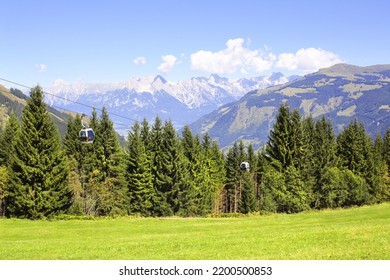 Alps mountains in Tirol, Austria. View of idyllic mountain scenery in Alps with cableway over a forest. European mountain landscape with cable car in National park High Tauern (Hohe Tauern) 