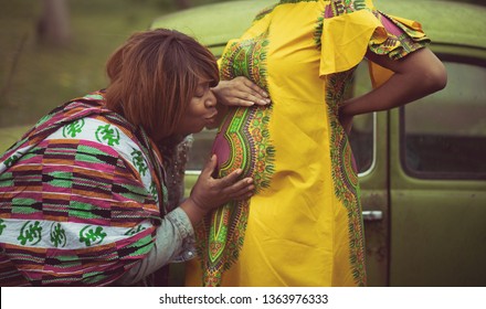 I Already Love You Baby. African American Pregnant Woman In The Park With Her Mother.