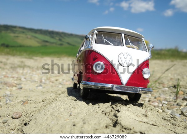 ALSACE, FRANCE - MAY\
29, 2015: Miniature VW Bulli 1962 on the rural road. The cult car\
of the Hippie generation and it remained the status vehicle of the\
high wave surfers.