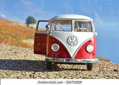 ALSACE, FRANCE - NOVEMBER 7, 2015:Miniature VW Bulli 1962 on the rural road. The cult car of the Hippie generation and it remained the status vehicle of the high wave surfers.