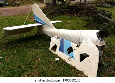 ALTAI REPUBLIC, RUSSIA - SEPTEMBER 27, 2020:The Tail Section Of The Crashed Plane On Lake Teletskoye In Western Siberia