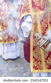 Altar Boy Or Acolyte In The Holy Week Procession Shaking A Censer To Produce Smoke And Fragrance Of Incense