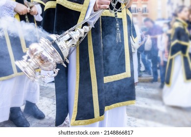 Altar Boy Or Acolyte In The Holy Week Procession Shaking A Censer To Produce Smoke And Fragrance Of Incense