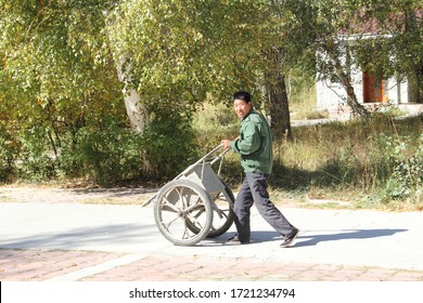 Altay, Xinjiang, China - 09-16/2019: A Chinese Street Cleaner 