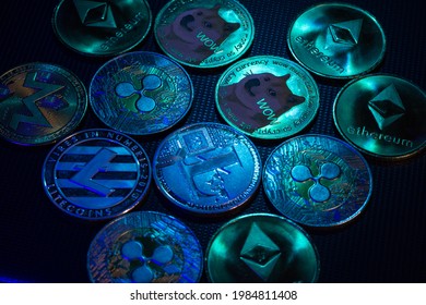 Altcoins over dark surface in neon light