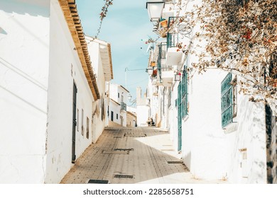 Altea old town with narrow streets and whitewashed houses. Architecture in small picturesque village of Altea near Mediterranean sea, Alicante province, Valencian Community, Spain - Powered by Shutterstock