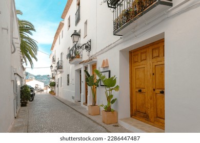 Altea old town with narrow streets and whitewashed houses. Architecture in small picturesque village of Altea near Mediterranean sea, Alicante province, Valencian Community, Spain - Powered by Shutterstock