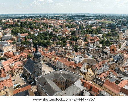 Altenburg Thuringia. Aerial view of the St. Bartholomew's Church towards the Red Peaks and Altenburg district. Small pond and art tower on the right edge. New development area in the background.