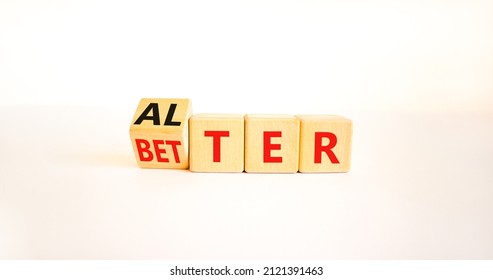 Alter or better symbol. Turned wooden cubes and changed the word Alter to Better. Beautiful white table, white background, copy space. Business and alter or better concept.