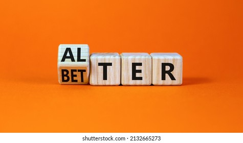Alter or better symbol. Turned wooden cubes and changed the word Alter to Better. Beautiful grey table, grey background, copy space. Business and alter or better concept.