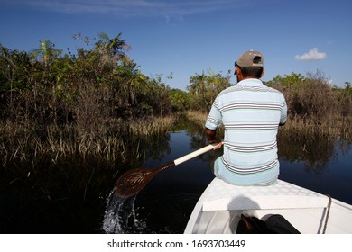 Alter Do Chão, Pará / Brazil - 09/13/2013: Man Rowing Canoe Near The Bank Of The Tapajós River