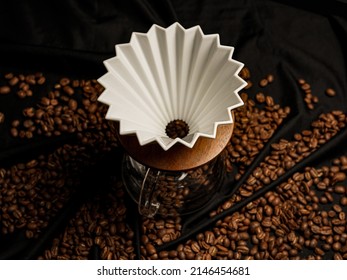 Alternating filter manual brewing of coffee close up. Coffee beans and Black background top view