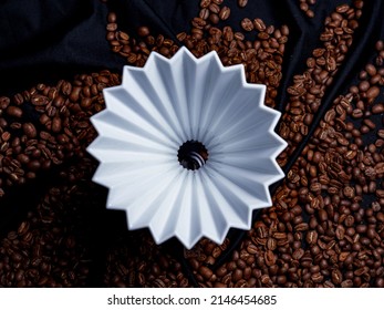 Alternating filter manual brewing of coffee close up. Coffee beans and Black background top view