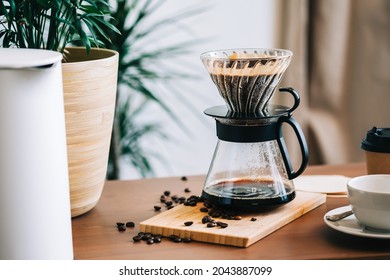 Alternative coffee brewing method, using pour over dripper and paper filter. - Powered by Shutterstock