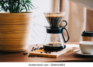 Alternative coffee brewing method, using pour over dripper and paper filter. - Shutterstock ID 2046414854