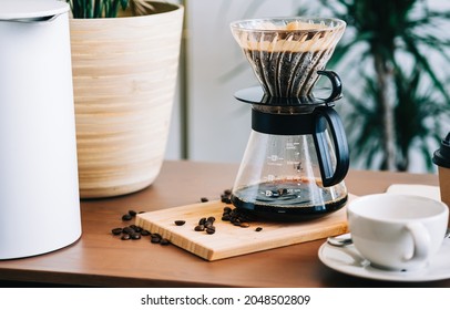 Alternative coffee brewing method, using pour over dripper and paper filter. - Shutterstock ID 2048502809