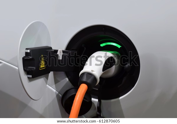 Alternative energy for cars.Fuel nozzle. Fuel nozzle on\
gas station.  