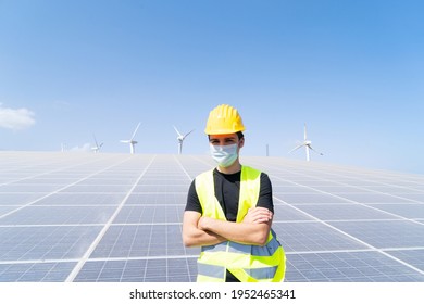 Alternative Energy - Engineer On Solar Panels Plant, Wearing Protective Mask During Pandemia Of Coronavirus Covid 19, Green Energy And Eco Friendly Industry Concept