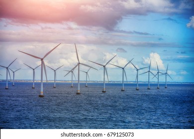 Alternative energy - shot of row of floating wind turbines