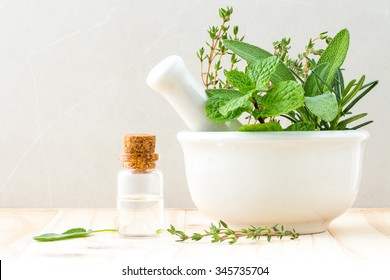 Alternative health care fresh herbal and  Bottle of aromatherapy in mortar on wooden background. - Powered by Shutterstock