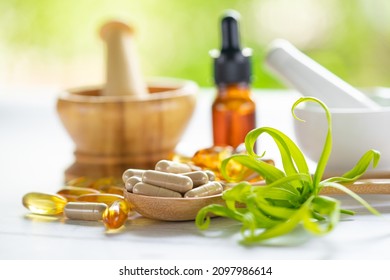 Alternative medicine herbal organic capsule with vitamin E omega 3 fish oil, mineral, drug with herbs leaf natural supplements for healthy good life. - Shutterstock ID 2097986614