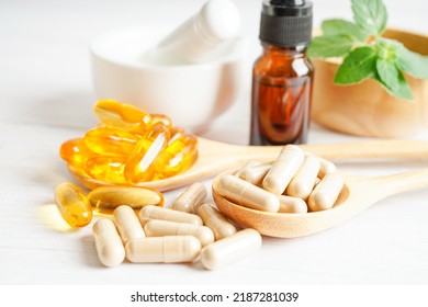 Alternative medicine herbal organic capsule with vitamin E omega 3 fish oil, mineral, drug with herbs leaf natural supplements for healthy good life. - Shutterstock ID 2187281039