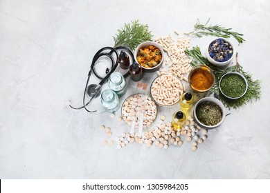 Alternative medicine herbs and homeopathic globules. Homeopathy medicine concept. Top view with copy space - Shutterstock ID 1305984205