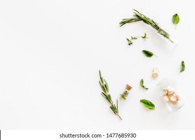 Alternative Medicine With Medicinal Herbs And Pills On White Background Top View Mock Up