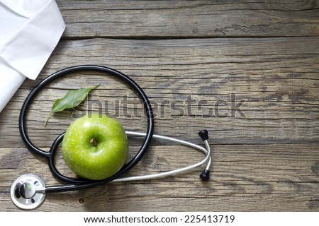 Alternative medicine stethoscope and green symbol background