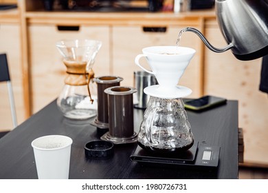 Alternative method of making coffee, funnel drip glasses with paper filter pour over kettle process.