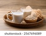 Alternative milk made from plant on wooden background, non dairy, Vegan food