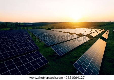 Alternative power source to saving environment.Solar panels park generating green energy electric at sunset.Green energy reduce carbon emissions and makes earth cleaner and more ecological
