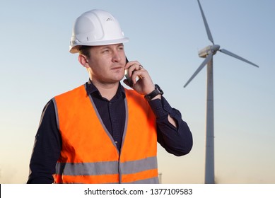Alternative or Renewable Energy Technology Project Development Concept, Engineer electricity with wind turbines. a man talking on the phone
